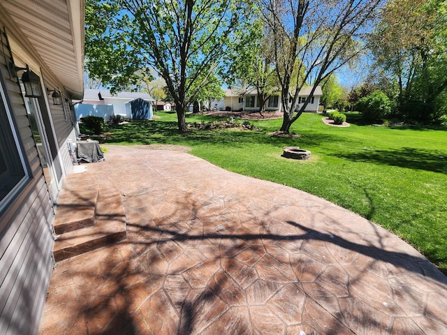 1120 W Blackhawk Dr, Fort Atkinson, WI 53538 - view of patio / terrace featuring an outdoor fire pit
