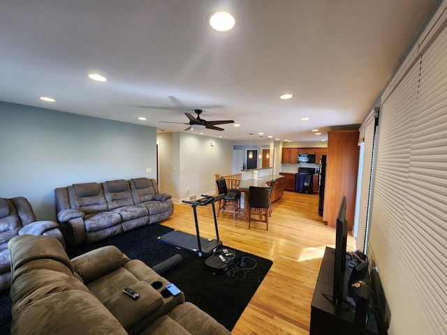 1120 W Blackhawk Dr, Fort Atkinson, WI 53538 - living area with recessed lighting, light wood-type flooring, a ceiling fan, and a barn door