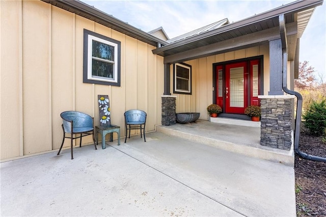 doorway to property featuring board and batten siding