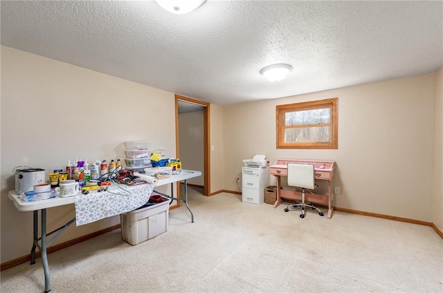office space featuring carpet, a textured ceiling, and baseboards