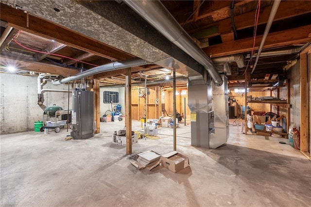 unfinished basement featuring gas water heater and heating unit