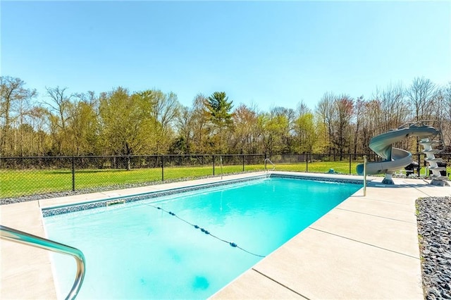 view of swimming pool with a water slide