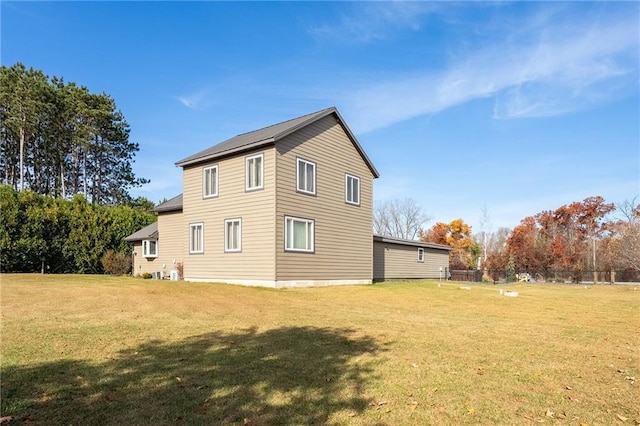view of property exterior featuring a lawn