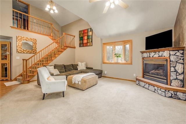 living room with stairway, baseboards, a fireplace, carpet flooring, and high vaulted ceiling