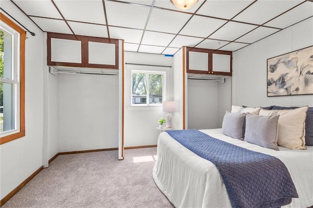 119 E 1st St, Dresser, WI 54009 - bedroom with multiple closets, light colored carpet, and baseboards