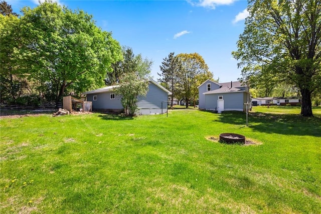 119 E 1st St, Dresser, WI 54009 - view of grassy yard featuring a fire pit