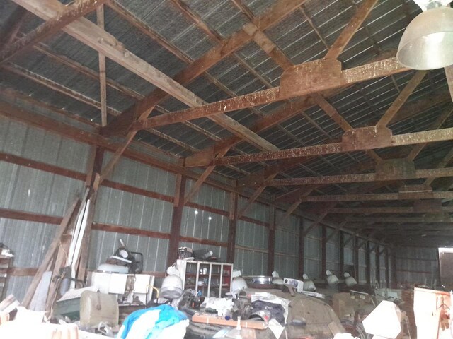 N2184 County Rd E, Redgranite, WI 54970 - miscellaneous room featuring metal wall and vaulted ceiling