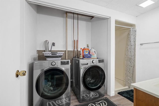 840 Waterworks Rd, Nekoosa, WI 54457 - laundry area featuring separate washer and dryer and wood finished floors