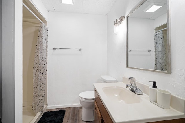 840 Waterworks Rd, Nekoosa, WI 54457 - bathroom with a stall shower, toilet, vanity, and wood finished floors