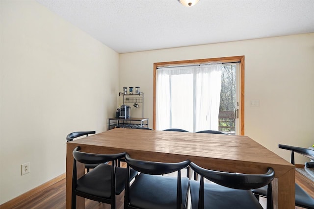 840 Waterworks Rd, Nekoosa, WI 54457 - dining space with dark wood-type flooring and baseboards