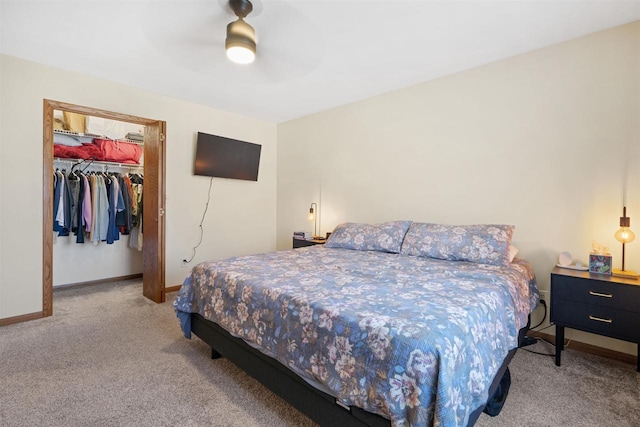 840 Waterworks Rd, Nekoosa, WI 54457 - carpeted bedroom featuring baseboards, a closet, ceiling fan, and a walk in closet