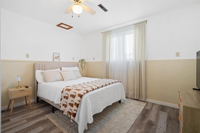 840 Waterworks Rd, Nekoosa, WI 54457 - bedroom featuring wood finished floors, a ceiling fan, and baseboards