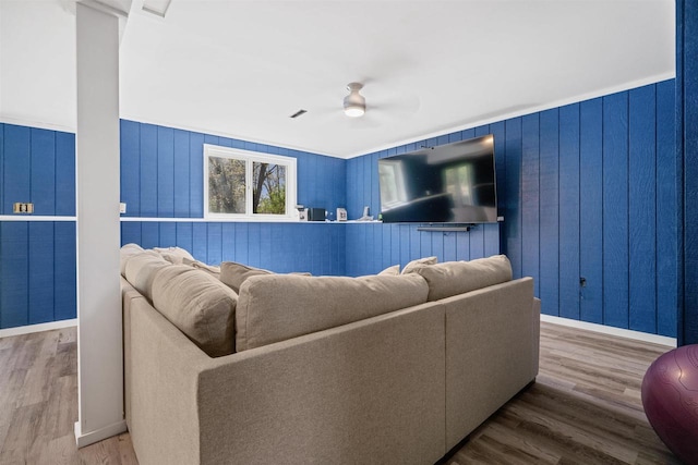 840 Waterworks Rd, Nekoosa, WI 54457 - living area with a ceiling fan, wood finished floors, wooden walls, and baseboards