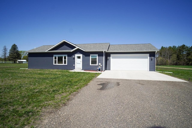 16845 Hawk Rd, Sparta, WI 54656 - view of front facade featuring a front lawn, driveway, and an attached garage