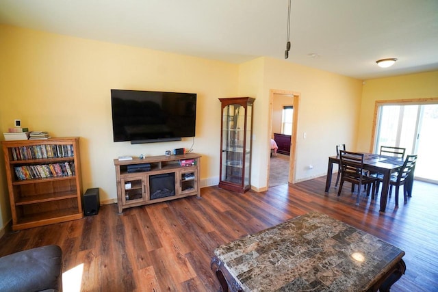 16845 Hawk Rd, Sparta, WI 54656 - living room featuring dark wood-style floors and baseboards