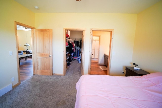16845 Hawk Rd, Sparta, WI 54656 - bedroom with a spacious closet, carpet floors, a closet, and baseboards