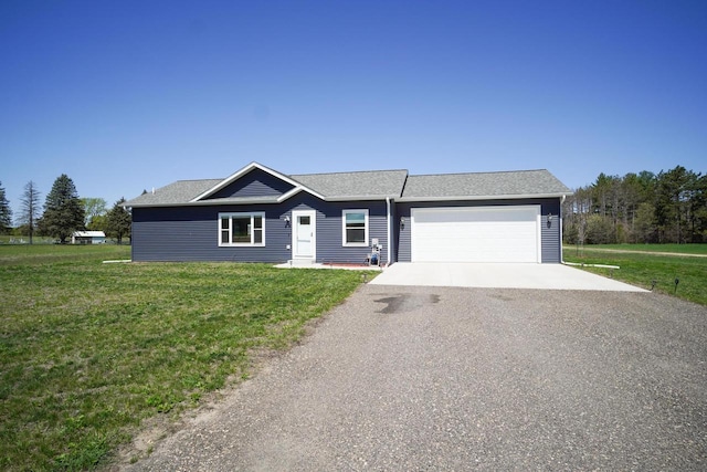 16845 Hawk Rd, Sparta, WI 54656 - single story home featuring asphalt driveway, a front yard, and an attached garage