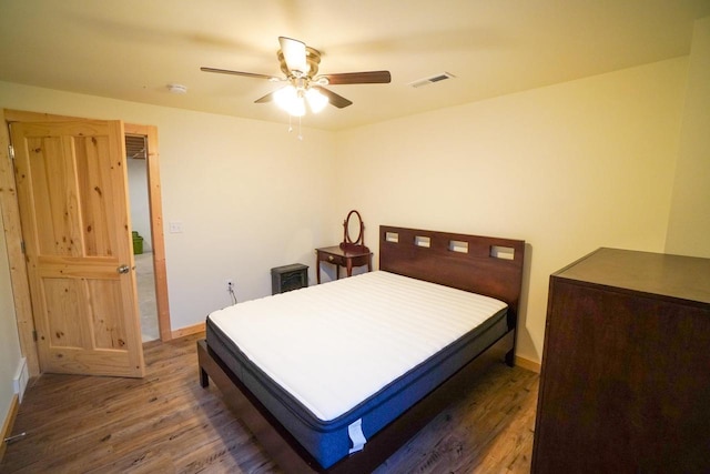 16845 Hawk Rd, Sparta, WI 54656 - bedroom with wood finished floors, baseboards, and ceiling fan