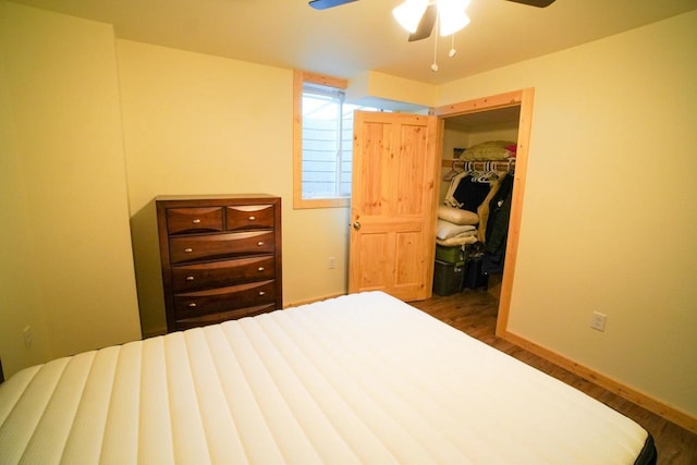 16845 Hawk Rd, Sparta, WI 54656 - bedroom featuring wood finished floors, a walk in closet, a ceiling fan, and baseboards