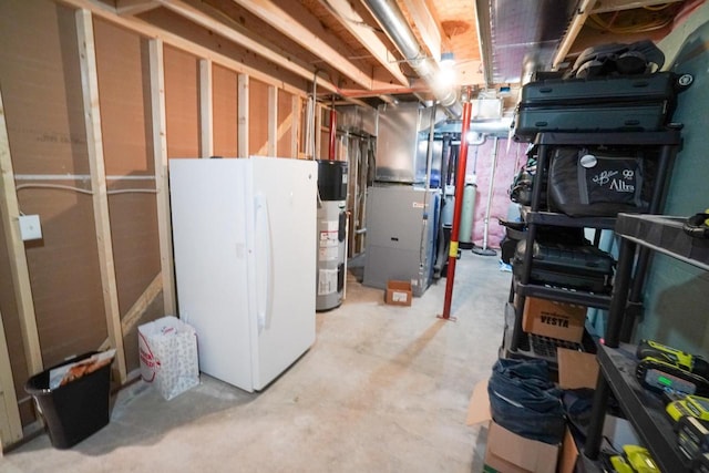 16845 Hawk Rd, Sparta, WI 54656 - unfinished basement with freestanding refrigerator, water heater, and heating unit