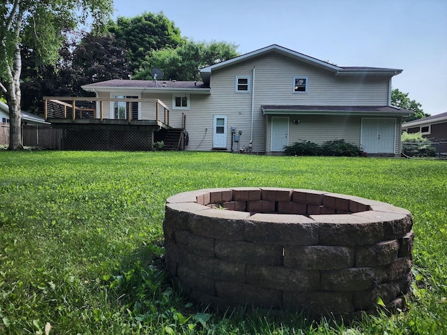 7122 Mockingbird Ln, Middleton, WI 53562 - back of property with a fire pit, a wooden deck, and stairway