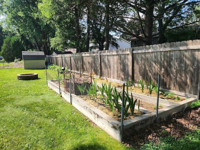 7122 Mockingbird Ln, Middleton, WI 53562 - view of yard featuring a vegetable garden and a storage unit