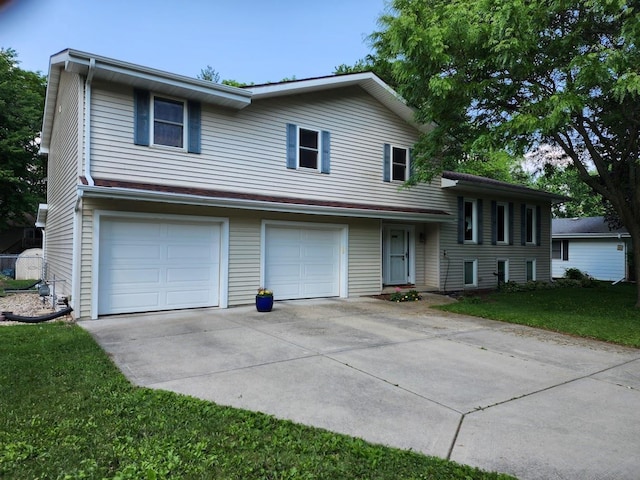 7122 Mockingbird Ln, Middleton, WI 53562 - split level home featuring driveway, a garage, and a front yard