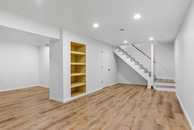 26 Prentice Pl, Madison, WI 53704 - finished below grade area featuring stairs, wood finished floors, recessed lighting, and baseboards