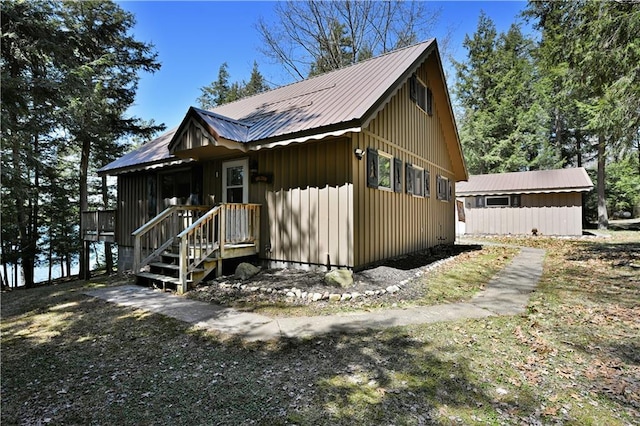 47025 Twin Pines Ln, Cable, WI 54821 - view of front of house featuring metal roof and board and batten siding