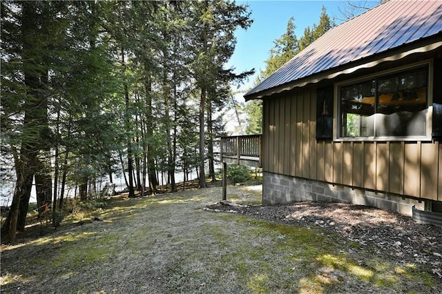 47025 Twin Pines Ln, Cable, WI 54821 - view of side of home featuring metal roof and board and batten siding
