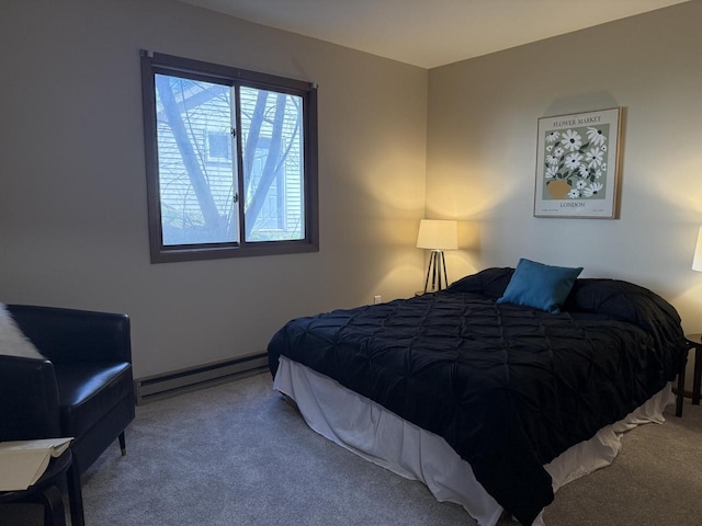 carpeted bedroom with a baseboard heating unit