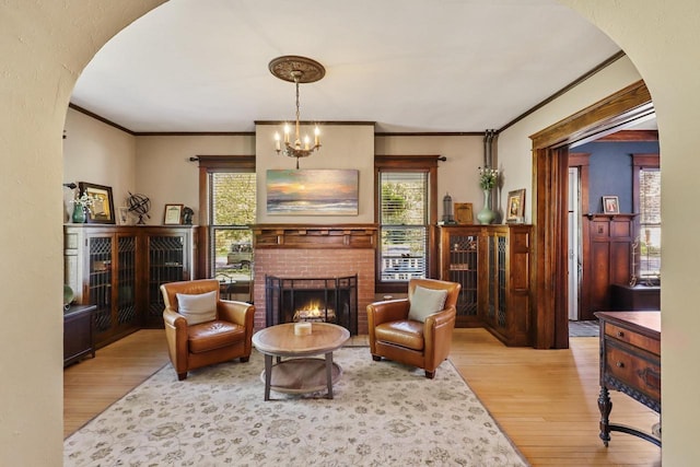 350 Madison St, Wisconsin Rapids, WI 54494 - living area with wood finished floors, arched walkways, healthy amount of natural light, and ornamental molding