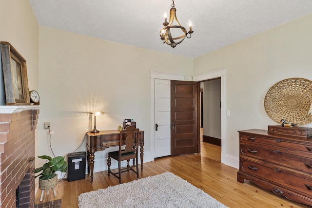 350 Madison St, Wisconsin Rapids, WI 54494 - office with hardwood / wood-style flooring, a chandelier, baseboards, and a fireplace