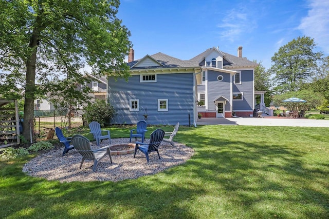 350 Madison St, Wisconsin Rapids, WI 54494 - back of house with a chimney and an outdoor fire pit