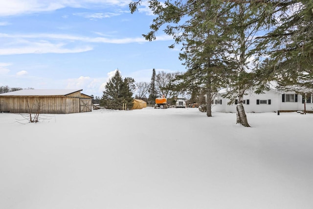 N10066 State Highway 180, Wausaukee, WI 54177 - yard covered in snow with an outbuilding