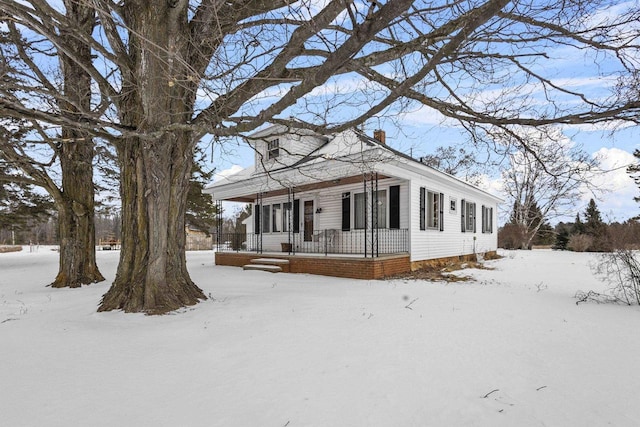 N10066 State Highway 180, Wausaukee, WI 54177 - view of front of home featuring covered porch and a chimney