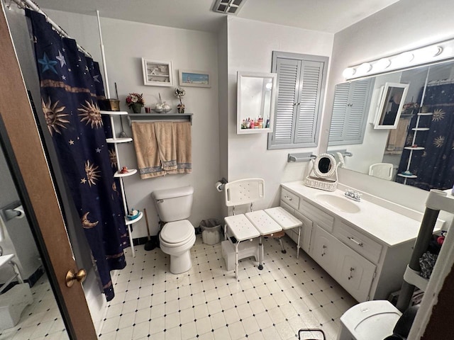 6054 W Port Ave, Milwaukee, WI 53223 - full bath with toilet, tile patterned floors, vanity, and a shower with shower curtain