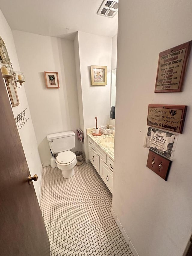 6054 W Port Ave, Milwaukee, WI 53223 - bathroom with toilet, tile patterned floors, vanity, and baseboards