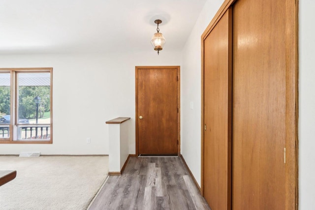 1445 17th Ave, Grafton, WI 53024 - foyer entrance featuring light wood-type flooring and baseboards