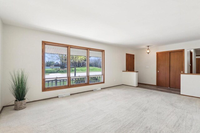 1445 17th Ave, Grafton, WI 53024 - unfurnished living room featuring carpet flooring