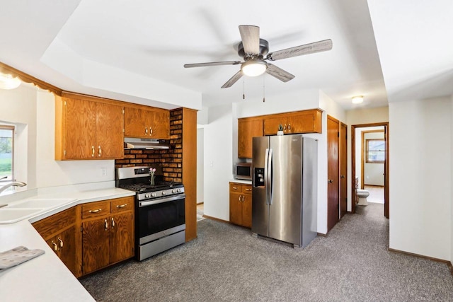 1445 17th Ave, Grafton, WI 53024 - kitchen featuring stainless steel appliances, a sink, under cabinet range hood, and light countertops