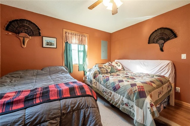 N3751 Bryant Rd, Bruce, WI 54819 - bedroom with ceiling fan, baseboards, and wood finished floors