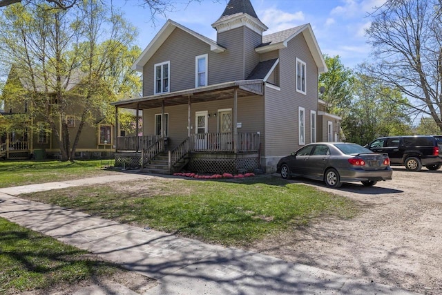 116 N Broad St, Elkhorn, WI 53121 - view of front of home featuring a porch, a front lawn, and roof with shingles