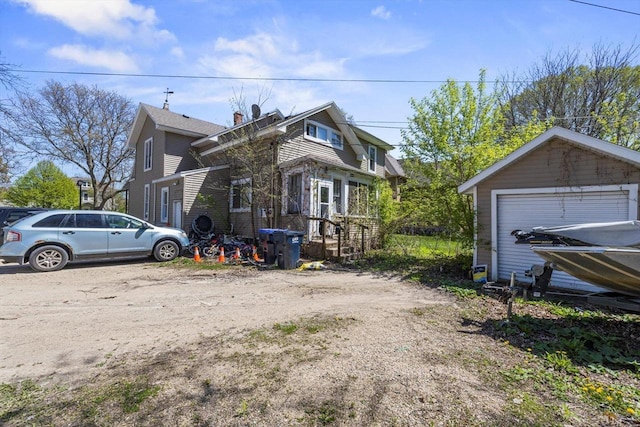 116 N Broad St, Elkhorn, WI 53121 - view of side of home featuring a garage
