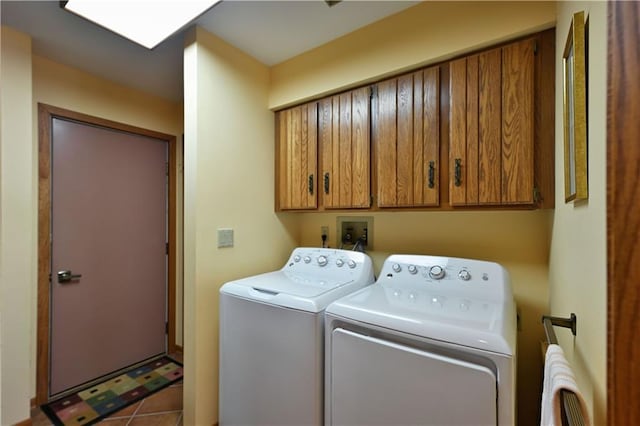 23075 Missionary Point Dr, Cable, WI 54821 - washroom featuring washer and clothes dryer, cabinet space, and tile patterned floors