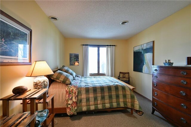 23075 Missionary Point Dr, Cable, WI 54821 - carpeted bedroom featuring a textured ceiling and baseboards