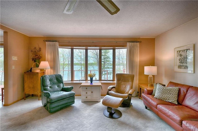 23075 Missionary Point Dr, Cable, WI 54821 - living room featuring ornamental molding, light carpet, a textured ceiling, and a ceiling fan