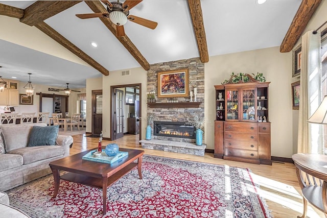 335 Bella Way, Sun Prairie, WI 53590 - living area featuring a ceiling fan, light wood-style floors, healthy amount of natural light, a fireplace, and recessed lighting