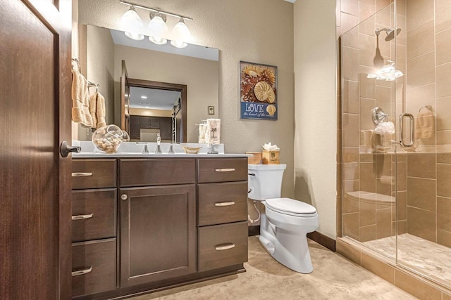 335 Bella Way, Sun Prairie, WI 53590 - bathroom with toilet, a shower stall, vanity, and a textured wall