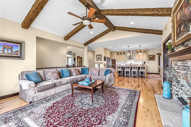 335 Bella Way, Sun Prairie, WI 53590 - living area with a ceiling fan, light wood-style flooring, a stone fireplace, recessed lighting, and baseboards